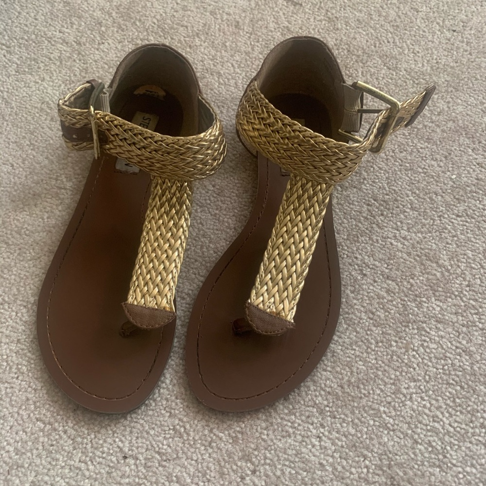 Steve Madden flat sandals.
